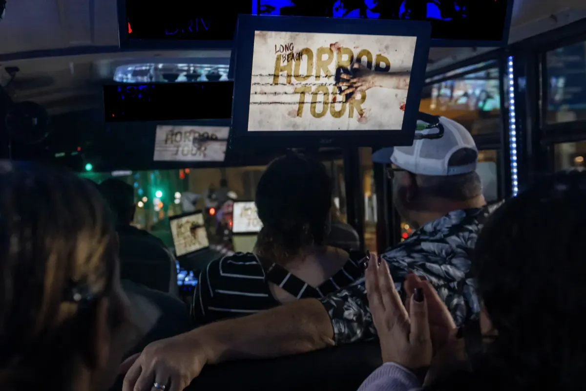 Horror Tour title on a video screen inside the tour bus